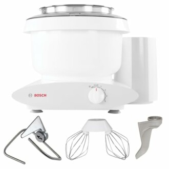 Bosch kitchen mixer with dough hook, wire whisks, and scraper attachments.