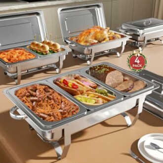 Chafing dishes with various foods including pasta, meat, and salad.